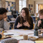 Young people working together in a community setting, illustrating skills, belonging and social capital.